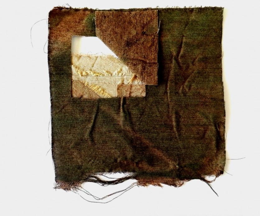 Textile artwork, made up of a green-brown square of fabric with frayed edges, and a square cut out of the center and pulled back.