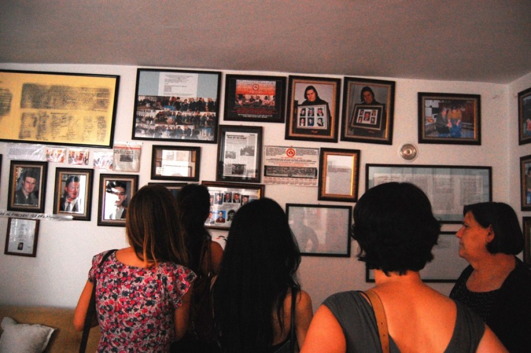 The walls of a house covered in photographs.