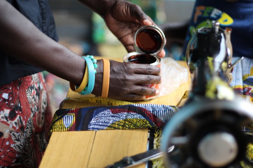 The hands of an artisan in her workshop.